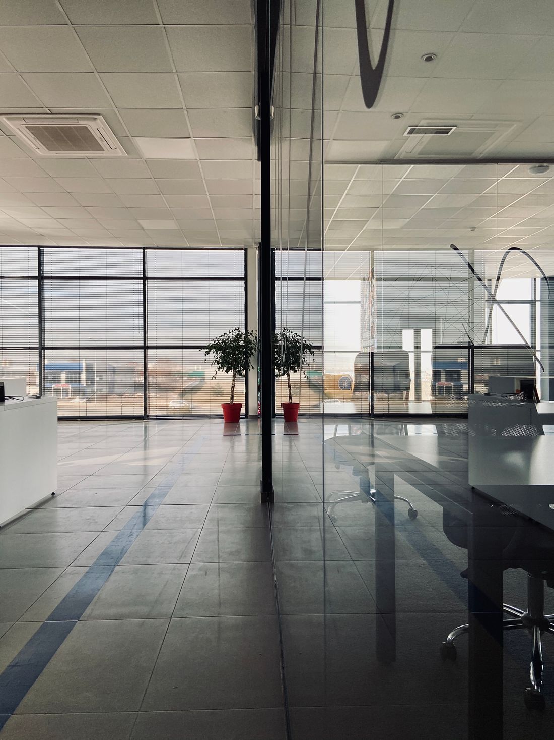 Bright, modern office workspace with floor-to-ceiling windows